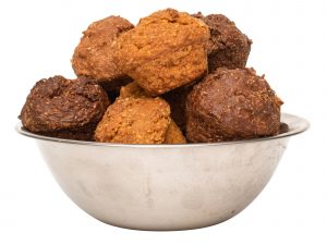 A small silver bowl full of real meat dog muffins. Chicken, beef and liver muffins.