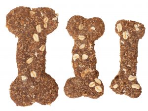Homemade Oats & Molasses dog biscuits in a bone shape. Available in three sizes, small, large and extra-large.